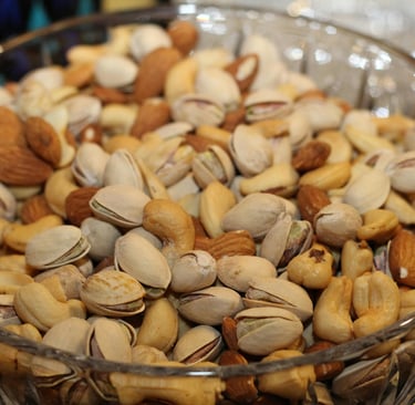 a bowl of nuts and nuts in a glass bowl