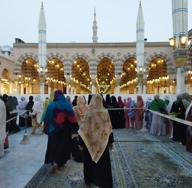 a woman in a black dress and a man in a white dress