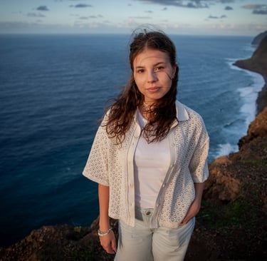 Young woman portrait at Ponta do Pargo cliff edge at dusk