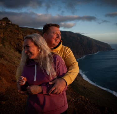 Couple embracing, smiling at Ponta do Pargo during twilight sunset
