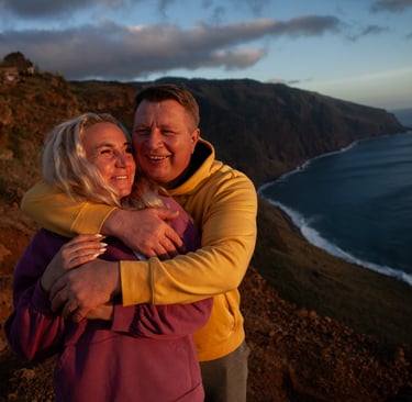 Couple embracing at Ponta do Pargo during twilight sunset