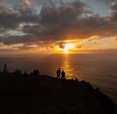 Dramatic sunset over Madeira mountains with family silhouettes