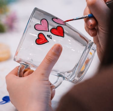 Glass painting hen party workshop with guests decorating glassware together