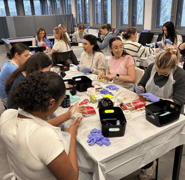 group of women making clay boob pots