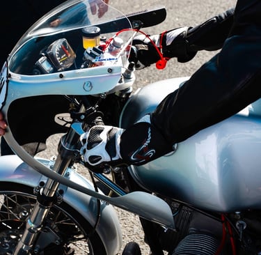 a person standing next to a motorcycle with a helmet on