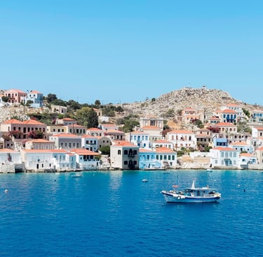 a boat in the water on the port of the Greek island Chalki