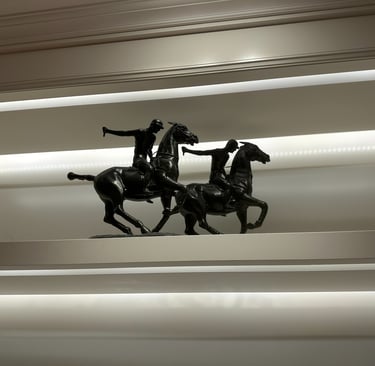 a statue of a man riding a horse