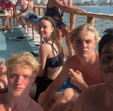 a group of people sitting on a boat