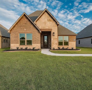 a house with a large front yard and a driveway