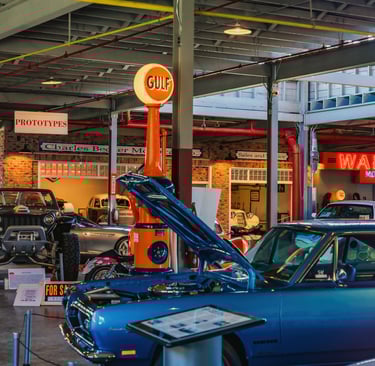 Interior of NATMUS with blue car and gulf oil sign