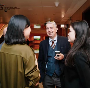 Professional networking event featuring business colleagues in conversation at a European Chamber event.