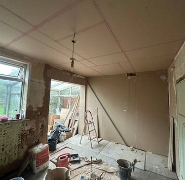 Plasterboarding to one wall almost finished and bonding used to level some areas before boarding.