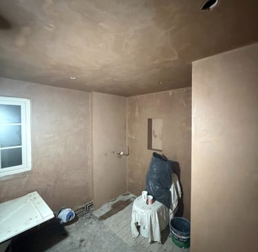 Skimming completed leaving smooth ceiling and walls ready for bathroom refit and decoration.