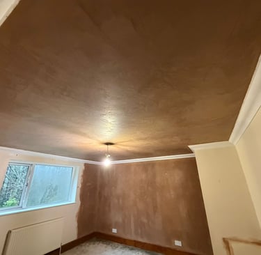 Artex removed and ceiling plastered leaving a lovely smooth surface ready for redecoration.