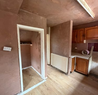 Ceiling and walls skimmed in this traditional kitchen with walk in pantry.