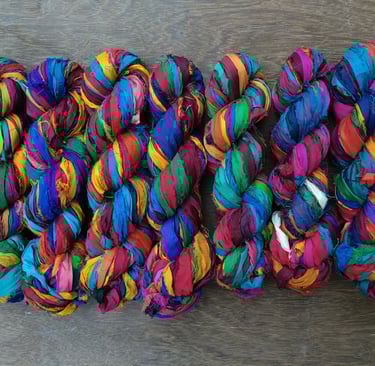 multicolour recycled sari silk ribbon yarn. 1" wide, 50+ meters in 100 gram skein