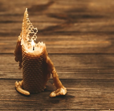 Eco-friendly beeswax candle burning naturally on a wooden table, sustainable alternative to paraffin