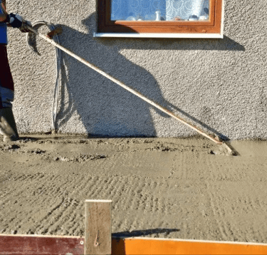 a man is using a concrete flooring machine