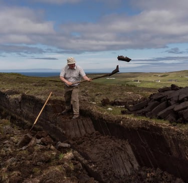 man using slean to cut and throw turf