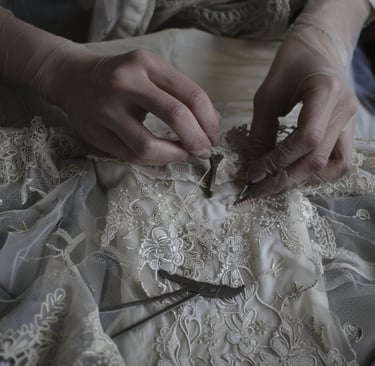 a woman in a white dress with a lace overlayed dress