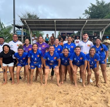 a group of people standing around a beach