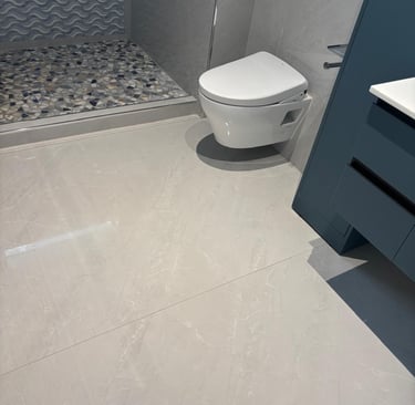 a bathroom with a shower and a shower clean floor and bathroom on post construction job