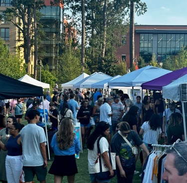 Cary Night Market with vendor tents and customers walking through a crowded area