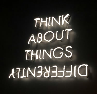 a neon sign that says think about things that are difficult to do