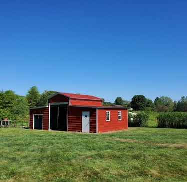 a red shed with a red roof and a red roof