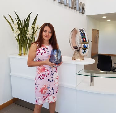 Selin holding the Queens Award at WAE reception
