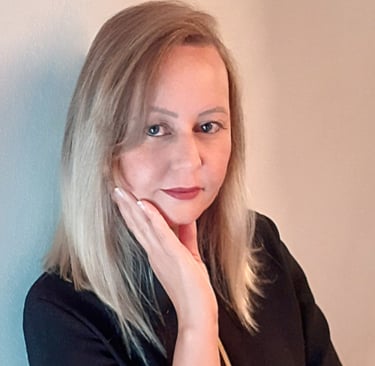 a woman with blonde hair and a black top