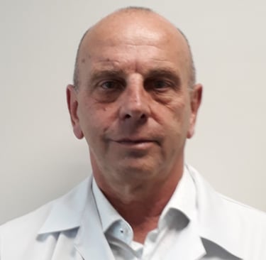 a man in a white lab coat and a white shirt