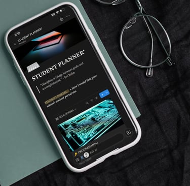 A smartphone displays a digital student planner app next to glasses on a dark fabric background.