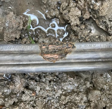 This is damage to the cover of a power line. Found when locating a fault.