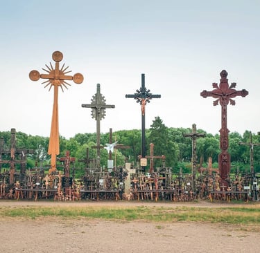 Thousands of ornate wooden and metal crosses at the Hill of Crosses pilgrimage site in Lithuania.