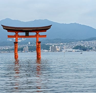 Miyajima Tori Gate and Hiroshima city in the background