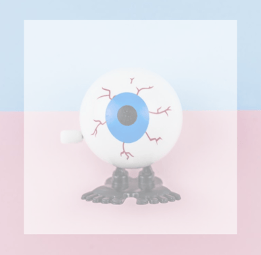 Dry Eye a toy eyeball with feet and red lines on eye
