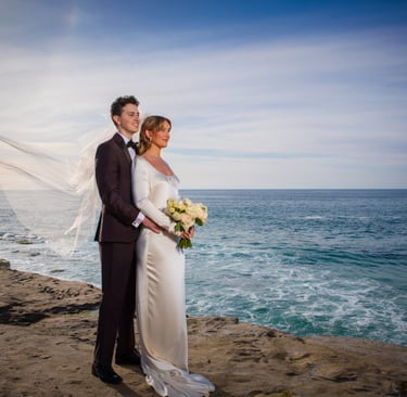 Bride and Groom standing on bluff in La Jolla, CA