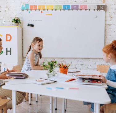 Three kids in a classroom