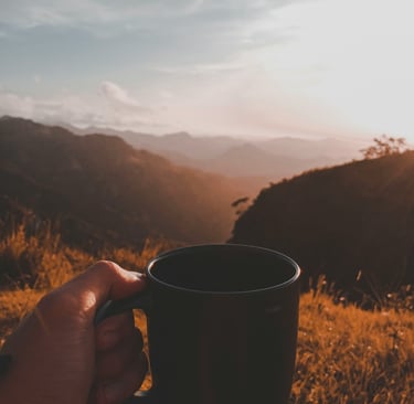 Coffee over a sunrise in the mountains time is money