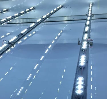 "Close-up of a vibrant LED sign displaying dynamic, colorful text and graphics."