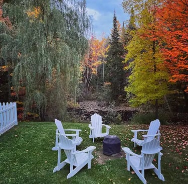 a fire pit with chairs and a fire pit