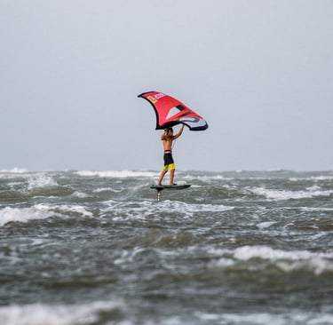 Red wingfoil in windy tuff conditions