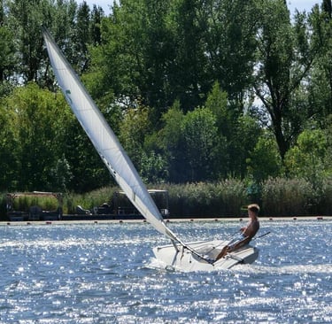 a man is sailing on the water