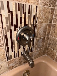 Repaired plumberrs mess, built framing in wall and tiled