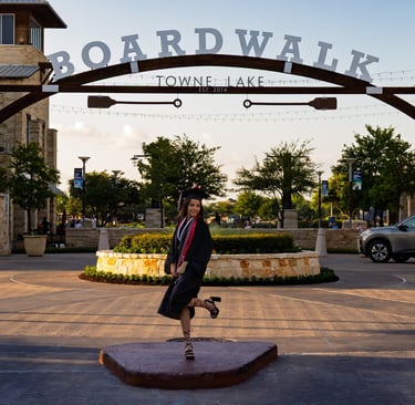 Graduation portrait taken of a young woman at The Boardwalk of Towne Lake, Cypress, TX