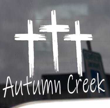 Three crosses with Autumn Creek underneath