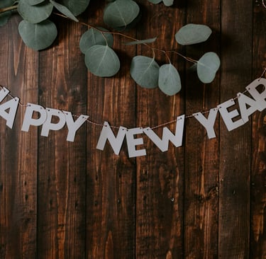 leaves and a garland saying happy new year