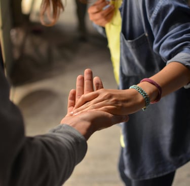a person holding a hand out to a person