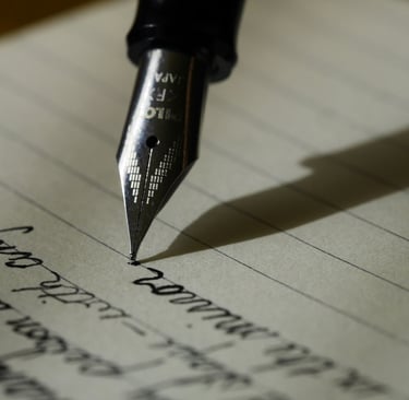 a pen and a fountain pen on a piece of paper